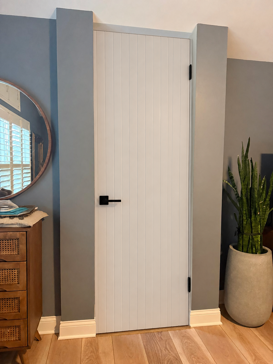 Painted MDF Single-Door V-Groove custom door installed in the proposed opening