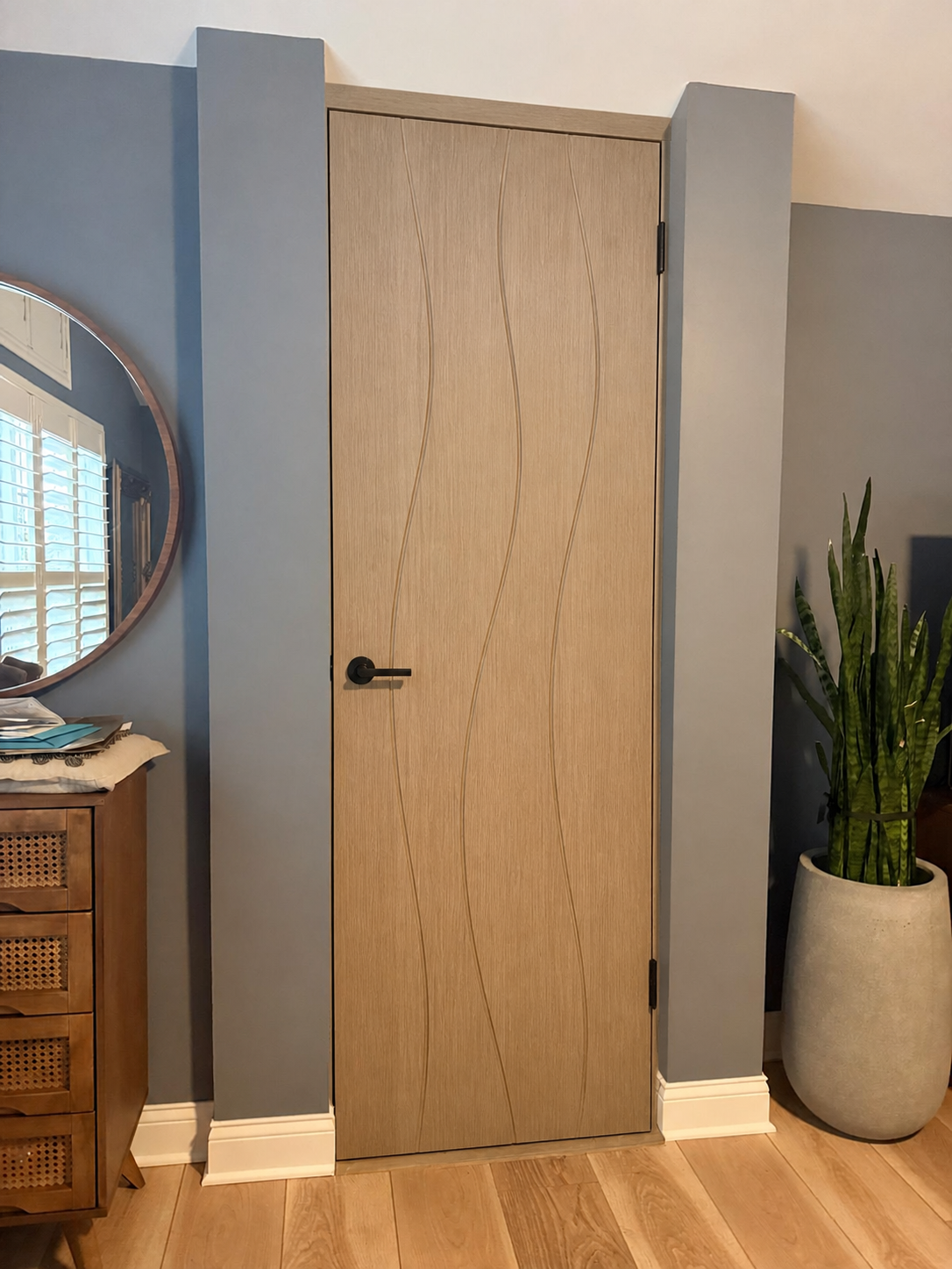 White Oak Single-Door Wave custom door installed in the proposed opening